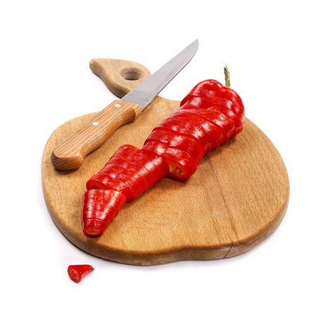 Red pepper on a kitchen boardの写真素材