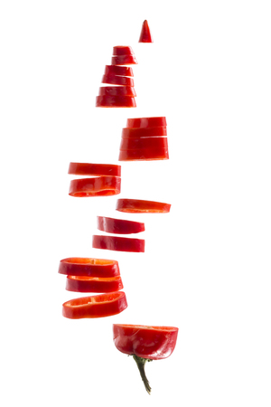 Pieces of red pepper on a white backgroundの写真素材