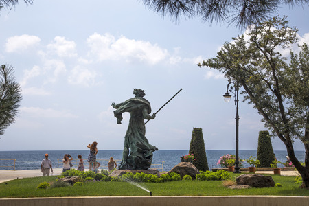 Tourists take pictures near the sculpture of Neptune in the park of the sanatorium "Aivazovsky"のeditorial素材
