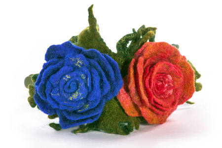 Wrap hair with a decorative ornament in the form of flowers from fulled wool on a white backgroundの写真素材