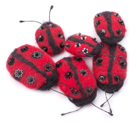 Brooches of fulled wool on a white backgroundの写真素材