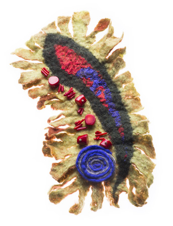 Brooch made of felt wool on a white backgroundの写真素材