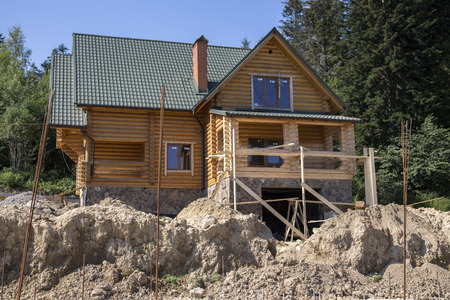 Construction of a wooden cottage in the forest areaのeditorial素材