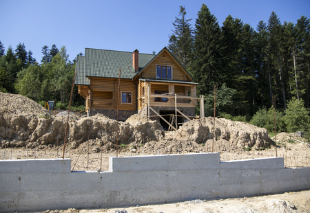 Construction of a wooden cottage in the forest areaのeditorial素材