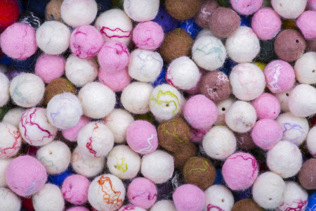 Background of multi-colored balls of wool feltedの写真素材