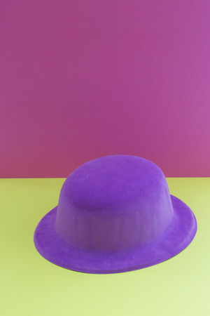Still-life with purple hat on a colored backgroundの写真素材