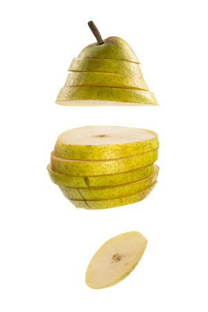 Cut into slices of ripe pear on a white backgroundの写真素材