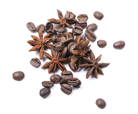 Fruits of anise and coffee beans on a white backgroundの写真素材