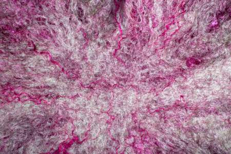 Background from natural merino wool felted closeupの写真素材