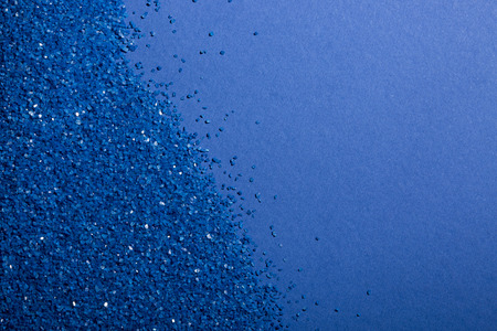 Background of blue sand on cardboard blueの写真素材