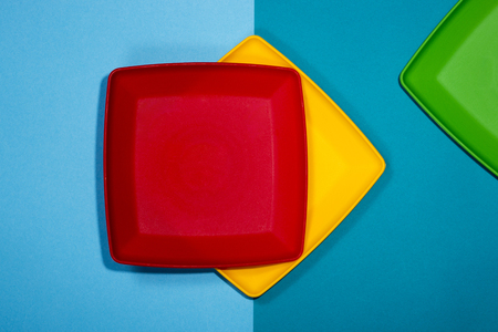 Abstract still life with red, yellow and green platesの写真素材