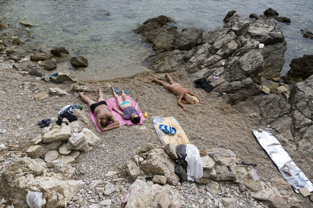People are resting on the beach in the city of Budva, Montenegro.のeditorial素材