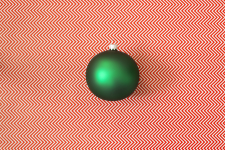Green Christmas tree ball on an abstract background.の写真素材