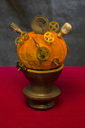 Surrealistic still life with pumpkin, gears and bulbsの写真素材