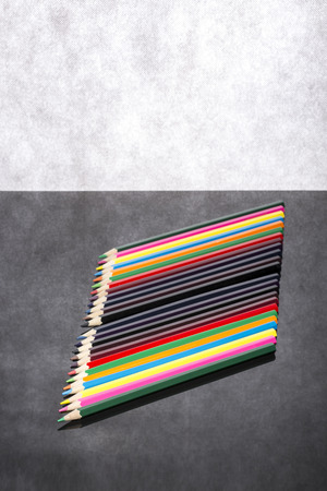 Set of colored pencils on a gray backgroundの写真素材
