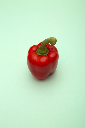 Red Sweet pepper on a green backgroundの写真素材