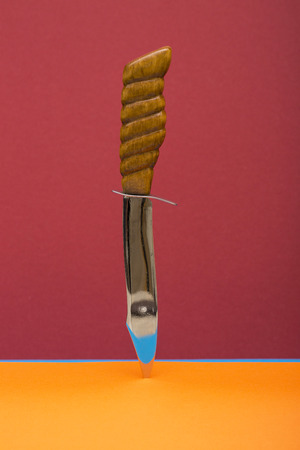 Large sharp knife on a colored backgroundの写真素材