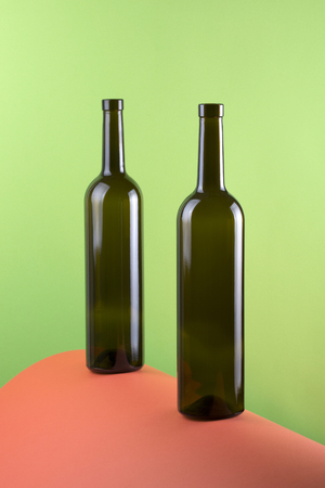 Abstract still life with color background and two glass bottlesの写真素材