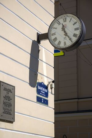 St. Petersburg, Russia - August 08, 2018: Street clock on the wall of the house on Manege Square in St. Petersburgのeditorial素材