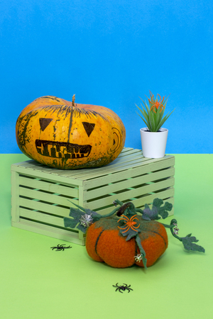 Still life with handmade pumpkins from felted wool for the celebration of Halloweenの写真素材