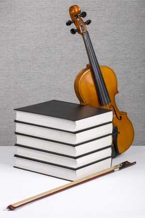 Still-life with a pile of books and a violinの写真素材