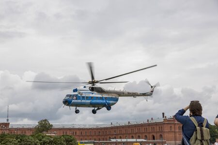St. Petersburg, Russia - August 11, 2018: The excursion helicopter MI-8 takes off from the site near...