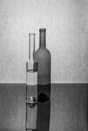 Black and white still life with two bottlesの写真素材