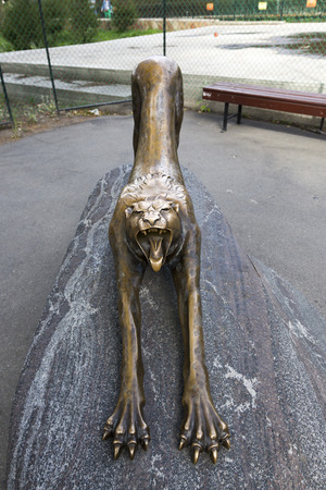 St. Petersburg, Russia - August 14, 2018: Bronze figure of a yawning leopard in the territory of the zoo in St. Petersburgのeditorial素材