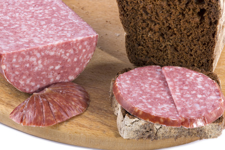 Bread and sausage Cervelat on the kitchen tableの写真素材