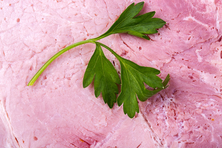 Background and texture of fresh pork ham with parsley closeupの写真素材
