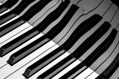 Fragment of electronic piano keyboard with reflectionの写真素材