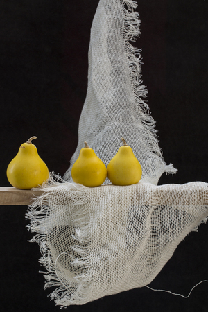 Still life with three small decorative pumpkinsの写真素材