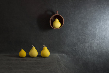 Still life with small decorative pumpkins on the table and in the bowlの写真素材