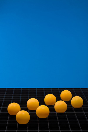 Abstract still life with orange balls on a blue backgroundの写真素材