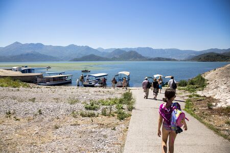 Lake Skadar, Montenegro - August 02, 2017: Tourists Landing at the Pleasure Boatのeditorial素材