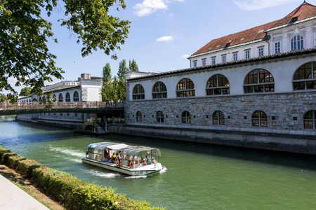 Ljubljana, Slovenia - August 15, 2019: View of the embankment of the Ljubljana River in Ljubljanaのeditorial素材