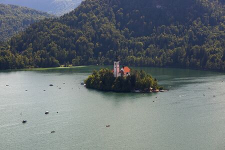 Bled, Slovenia - August 15, 2019: Church of the Assumption of the Virgin Mary on the island of Lake Bled in Sloveniaのeditorial素材