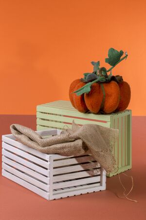 Still life with handmade pumpkin from felted wool for the celebration of Halloweenの写真素材