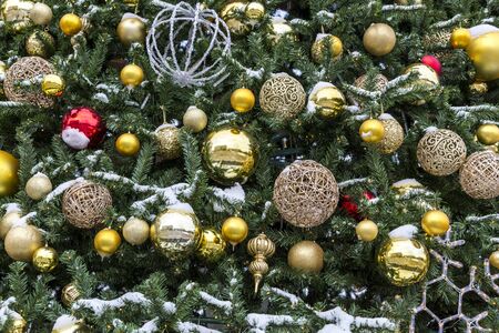 Christmas tree decorations and toys on the branches of the festive spruce