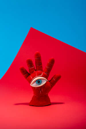 Protective amulet in the shape of an open palm and eye made of felted woolの写真素材