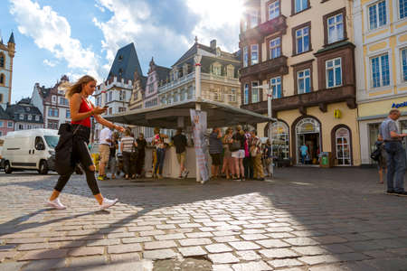 Trier, Germany - July 06, 2018: People rest in the central square of Trierのeditorial素材