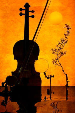 Violin on orange background with reflective surface. Sultry musicの写真素材
