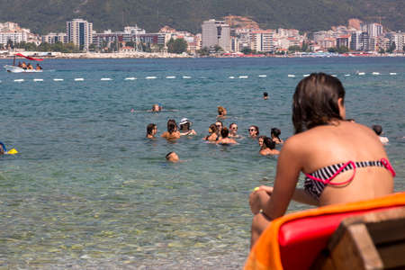 Budva, Montenegro - August 07, 2017: People swim in the sea at Beach on the island of St. Nicholas in the Adriatic Seaのeditorial素材