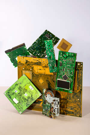 Abstract figure folded from computer circuit boards on a colored background