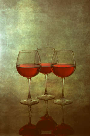Still life with glasses of wine on a blurred backgroundの写真素材