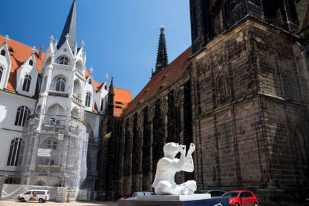 Meissen, Germany - June 05, 2013: Porcelain figurine in the courtyard of Meissen Cathedralのeditorial素材