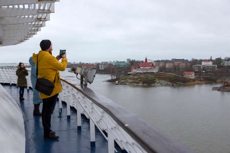 Helsinki, Finland - January 17, 2020: People photograph views of Helsinki from a passenger ferryのeditorial素材