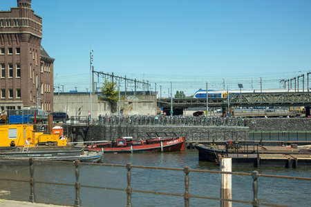 Amsterdam, Netherlands - July 02, 2018: Parking for bicycles on the banks of the Amstel river in Amsterdamのeditorial素材
