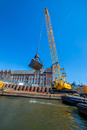 Amsterdam, Netherlands - July 02, 2018: Construction and installation works on the embankment of...