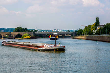 Koblenz, Germany - July 07, 2018: Carriage of goods by barges along the Moselle river in Koblenzのeditorial素材